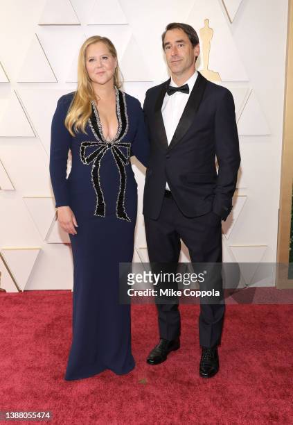 Amy Schumer and Chris Fischer attend the 94th Annual Academy Awards at Hollywood and Highland on March 27, 2022 in Hollywood, California.