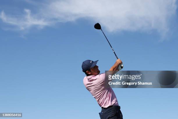 Scottie Scheffler of the United States plays his shot from the 14th tee in his finals match against Kevin Kisner of the United States on the final...