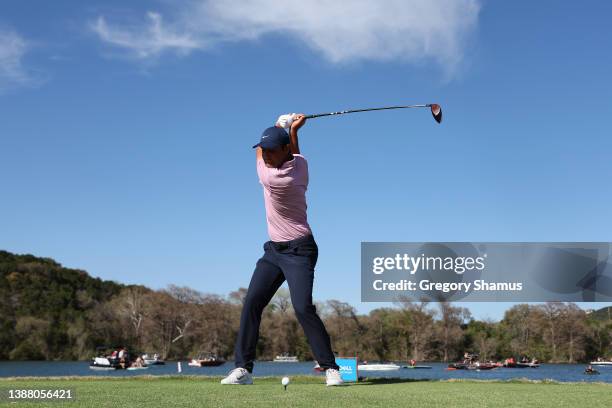 Scottie Scheffler of the United States plays his shot from the 14th tee in his finals match against Kevin Kisner of the United States on the final...