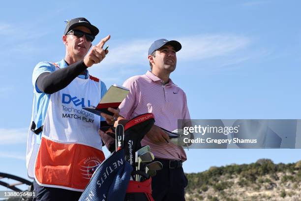 Scottie Scheffler of the United States talks with his caddie Ted Scott on the 14th hole in his finals match against \kkon the final day of the World...