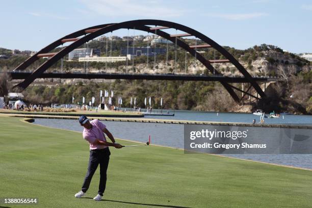 Scottie Scheffler of the United States plays a shot on the 13th hole in his finals match against Kevin Kisner of the United States on the final day...
