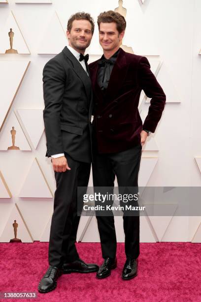 Jamie Dornan and Andrew Garfield attend the 94th Annual Academy Awards at Hollywood and Highland on March 27, 2022 in Hollywood, California.