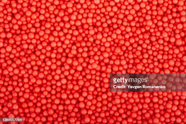 red foam balls as a background - polimero foto e immagini stock