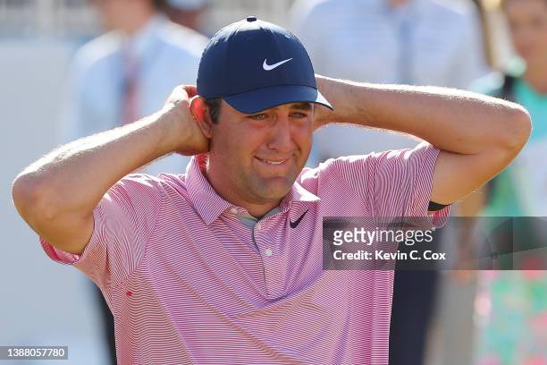 Scottie Scheffler of the United States celebrates after defeating Kevin Kisner of the United States 4&3 in their finals match to win the World Golf...