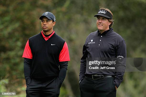 Tiger Woods and Phil Mickelson wait on the second tee during the final round of the AT&T Pebble Beach National Pro-Am at Pebble Beach Golf Links on...