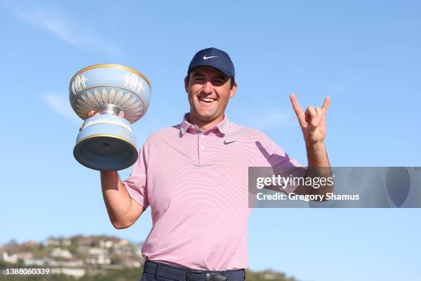 Scottie Scheffler of the United States poses with the Walter Hagen Cup after defeating Kevin Kisner of the United States 4&3 in their finals match to...