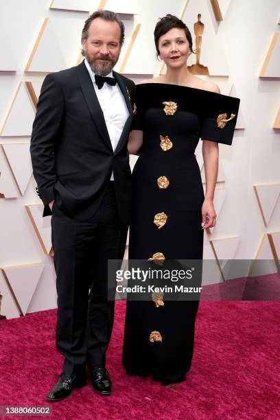 Peter Sarsgaard and Maggie Gyllenhaal attend the 94th Annual Academy Awards at Hollywood and Highland on March 27, 2022 in Hollywood, California.