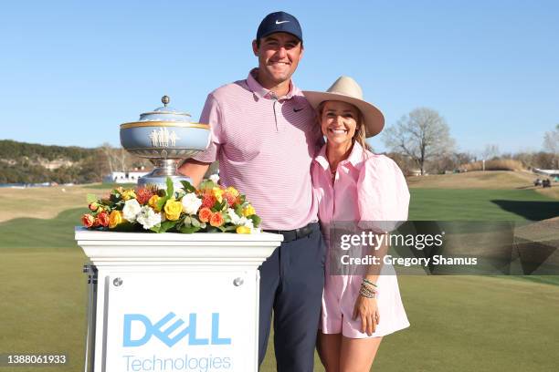 Scottie Scheffler of the United States poses with his wife Meredith Scheffler and the Walter Hagen Cup after defeating Kevin Kisner of the United...