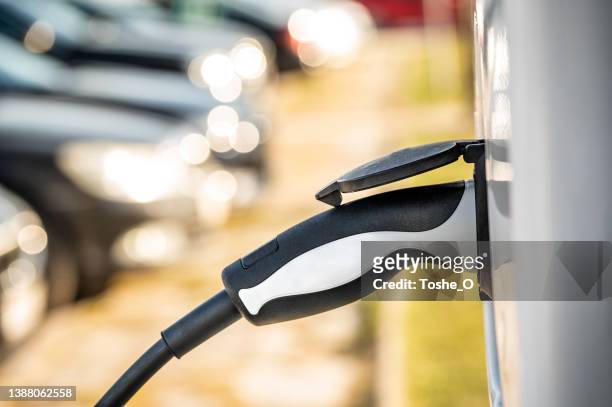 electric vehicle charging station - tesla truck stock pictures, royalty-free photos & images