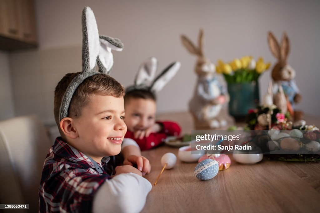 Two young boys wearing Easter bunny Ears