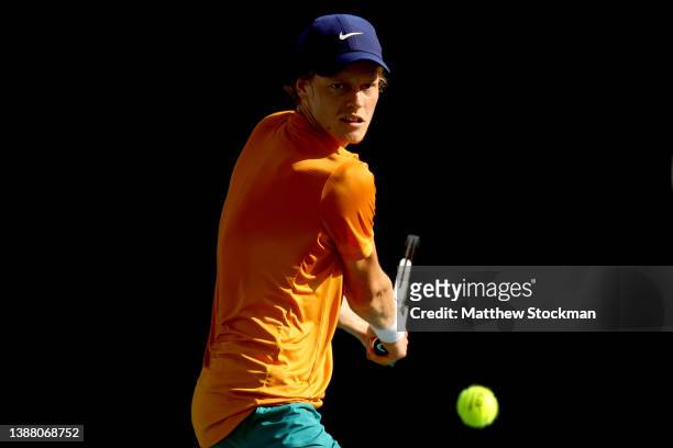 Jannik Sinner of Italy returns a shot to Pablo Carreno Busta of Spain during the Miami Open at Hard Rock Stadium on March 27, 2022 in Miami Gardens,...