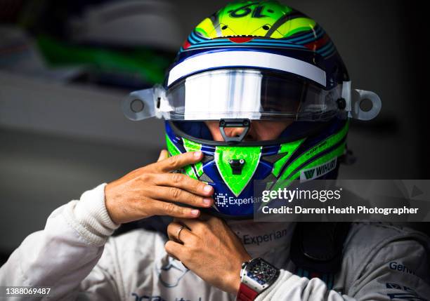Brazilian Williams Formula One racing team racing driver Felipe Massa in the team's pit lane, pit garage, wearing his logo adorned fire protection...