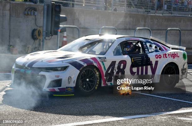 Alex Bowman, driver of the Ally Chevrolet, drives with flames on the grid after the NASCAR Cup Series Echopark Automotive Grand Prix at Circuit of...