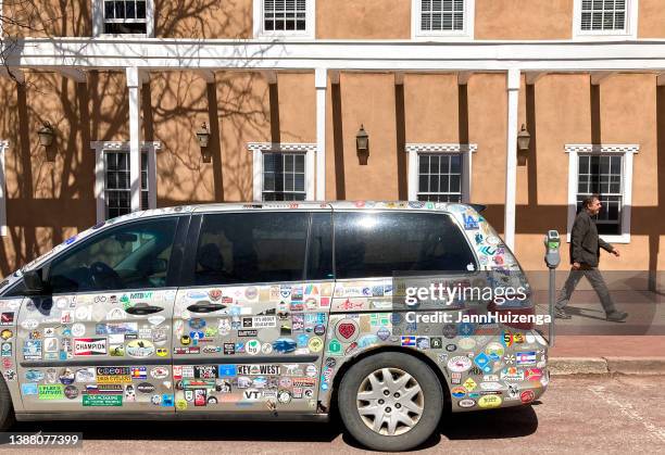 santa fe, nm: mini-van covered with usa bumper stickers - bumper sticker stock pictures, royalty-free photos & images