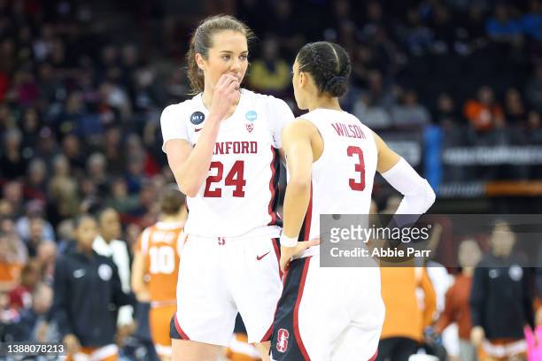 Lacie Hull of the Stanford Cardinal talks with Anna Wilson during a stopage in play during the first half against the Texas Longhorns in the NCAA...