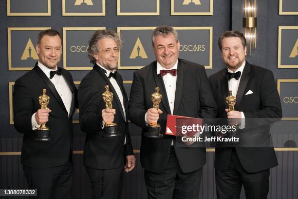 Brian Connor, Paul Lambert, Gerd Nefzer and Tristan Myles winners of the award for best visual effects for "Dune," pose in the press room during the...