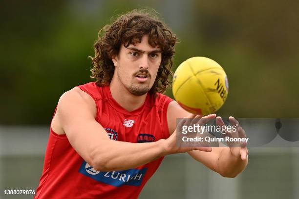 Luke Jackson of the Demons marks during a Melbourne Demons AFL training session at Gosch's Paddock on March 28, 2022 in Melbourne, Australia.