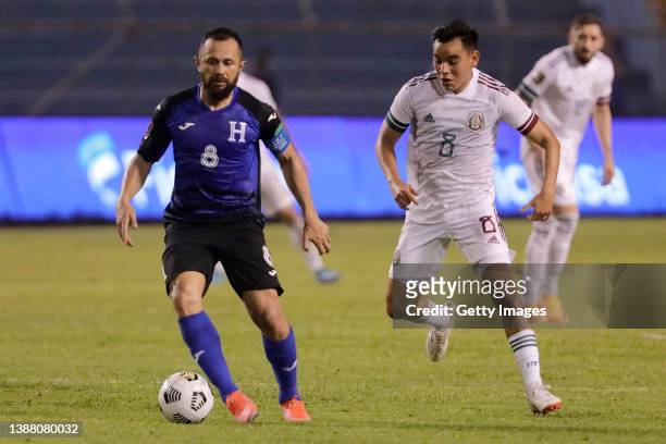 Alfredo Mejía of Honduras competes for the ball with Carlos Rodríguez of Mexico during the match between Honduras and Mexico as part of the Concacaf...