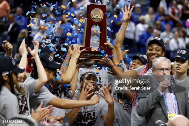 The South Carolina Gamecocks celebrate with the trophy after defeating the Creighton Bluejays, 80-50, in the second half in the NCAA Women's...
