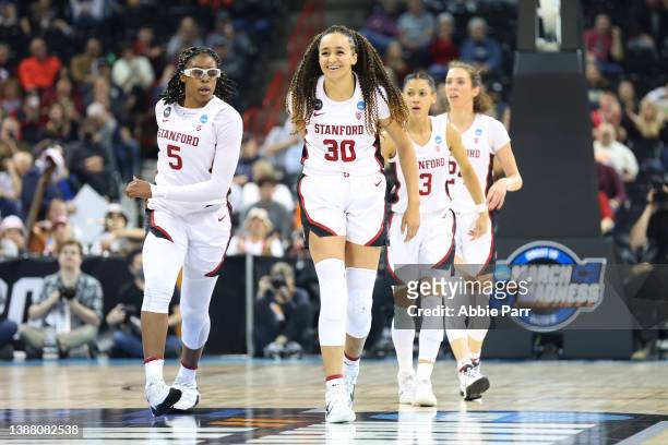 Haley Jones of the Stanford Cardinal celebrates with teammates after a score during the second quarter against the Texas Longhorns in the NCAA...