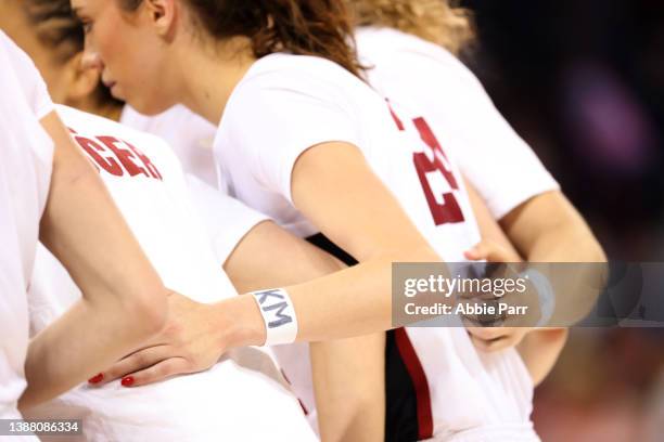 Lacie Hull of the Stanford Cardinal wears the letters KM on her wrist in honor of Stanford women's soccer player Katie Meyer during the first half...