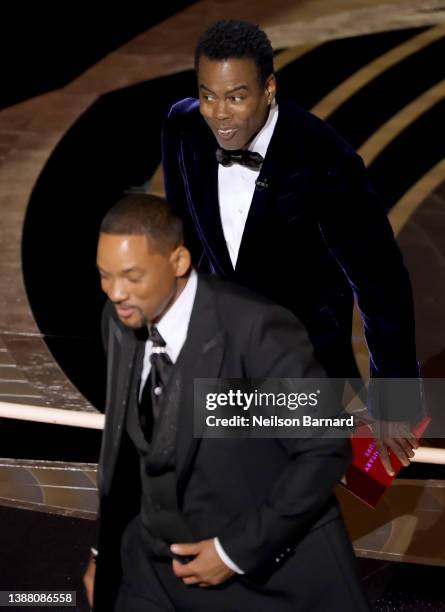 Will Smith and Chris Rock are seen onstage during the 94th Annual Academy Awards at Dolby Theatre on March 27, 2022 in Hollywood, California.