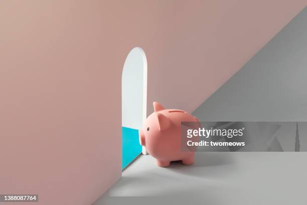 conceptual financial freedom still life with piggy bank. - financial freedom stock pictures, royalty-free photos & images