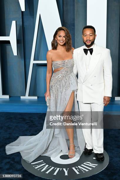 Christine Teigen and John Legend attend the 2022 Vanity Fair Oscar Party Hosted by Radhika Jones at Wallis Annenberg Center for the Performing Arts...