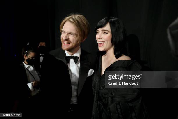 In this handout photo provided by A.M.P.A.S., Billie Eilish and FINNEAS are seen backstage during the 94th Annual Academy Awards at Dolby Theatre on...