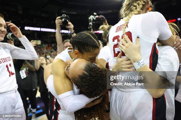 Anna Wilson of the Stanford Cardinal hugs Haley Jones after defeating the Texas Longhorns 59-50 in the NCAA Women's Basketball Tournament Elite 8...