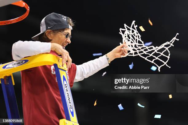 Head coach Tara VanDerveer of the Stanford Cardinal celebrates after cutting down the net after defeating the Texas Longhorns 59-50 in the NCAA...