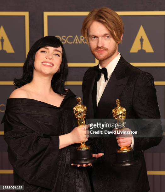 Billie Eilish and FINNEAS, winners of the Music award for ‘No Time to Die’, pose in the press room at the 94th Annual Academy Awards at Hollywood and...
