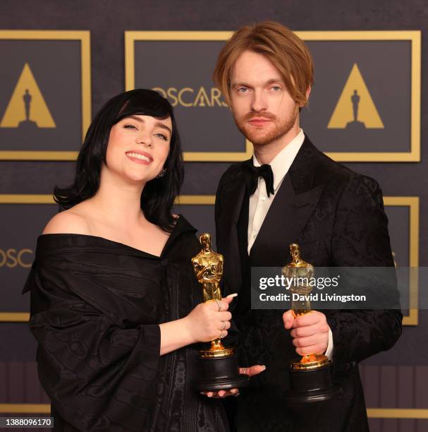 Billie Eilish and FINNEAS, winners of the Music award for ‘No Time to Die’, pose in the press room at the 94th Annual Academy Awards at Hollywood and...