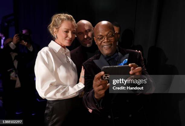 In this handout photo provided by A.M.P.A.S., Uma Thurman, John Travolta and Samuel L. Jackson are seen backstage during the 94th Annual Academy...
