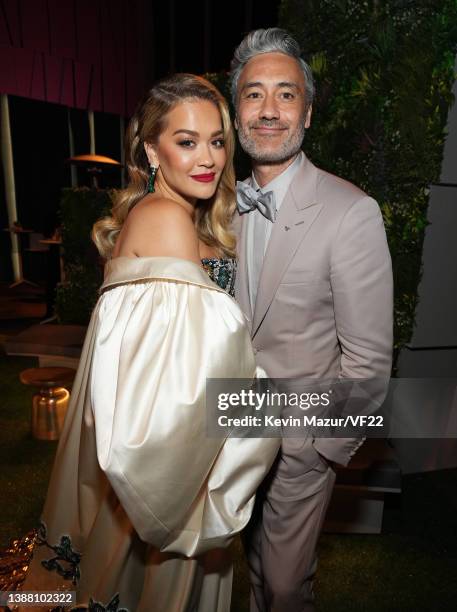 Rita Ora and Taika Waititi attend the 2022 Vanity Fair Oscar Party hosted by Radhika Jones at Wallis Annenberg Center for the Performing Arts on...