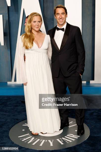 Amy Schumer and Chris Fischer attend the 2022 Vanity Fair Oscar Party hosted by Radhika Jones at Wallis Annenberg Center for the Performing Arts on...