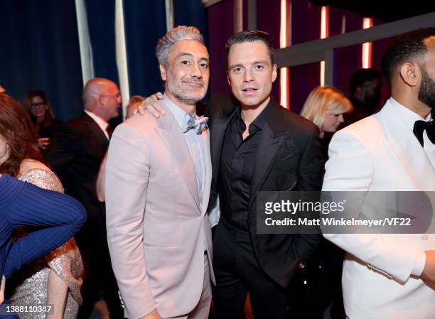 Taika Waititi and Sebastian Stan attend the 2022 Vanity Fair Oscar Party hosted by Radhika Jones at Wallis Annenberg Center for the Performing Arts...