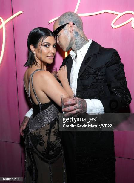 Kourtney Kardashian and Travis Barker attend the 2022 Vanity Fair Oscar Party hosted by Radhika Jones at Wallis Annenberg Center for the Performing...