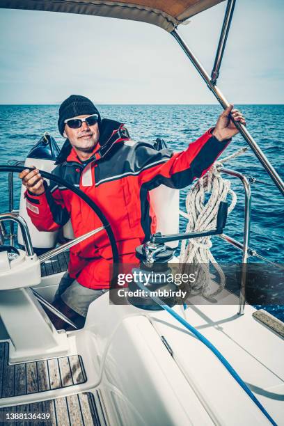 happy skipper on sailboat - regatta stock pictures, royalty-free photos & images