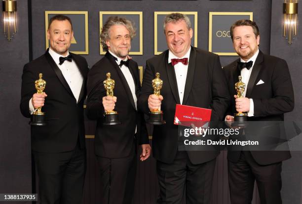 Tristan Myles, Brian Connor, Paul Lambert, Gerd Nefzer, winners of the Visual Effects award for ‘Dune,’ pose in the press room at the 94th Annual...