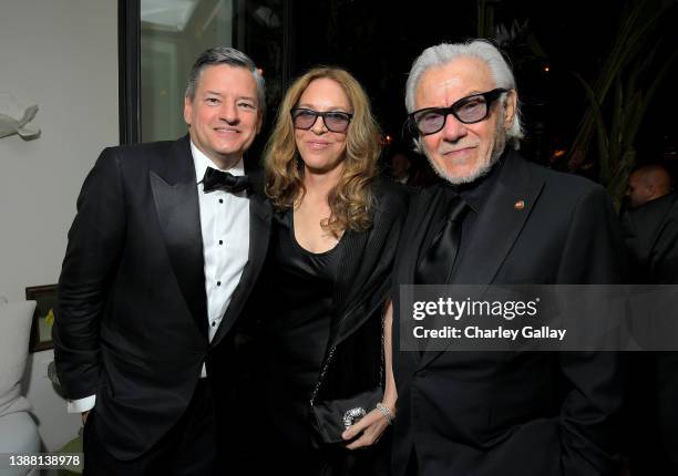 Netflix Chief Content Officer Ted Sarandos, Daphna Kastner and Harvey Keitel attend the 2022 Netflix Oscar After Party at San Vicente Bungalows on...