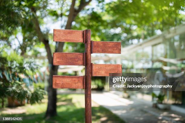 close-up of wooden sign board against green background - woodland cafe stock pictures, royalty-free photos & images