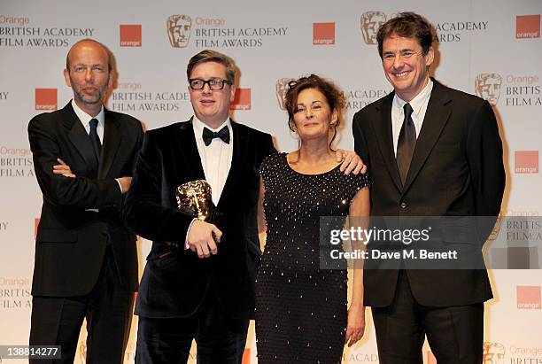 Outstanding British Film winners Tomas Alfredson, Tim Bevan, Eric Fellner and Robyn Slovo pose in the press room at the Orange British Academy Film...