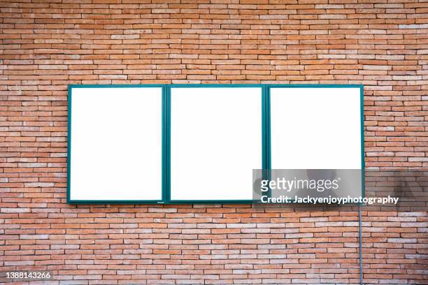blank billboard on brick wall - model building stockfoto's en -beelden
