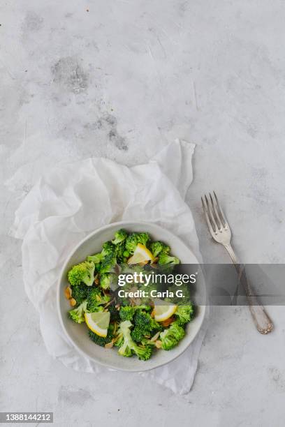 broccoli salad on rustic white background with copy space - broccoli white background stock pictures, royalty-free photos & images