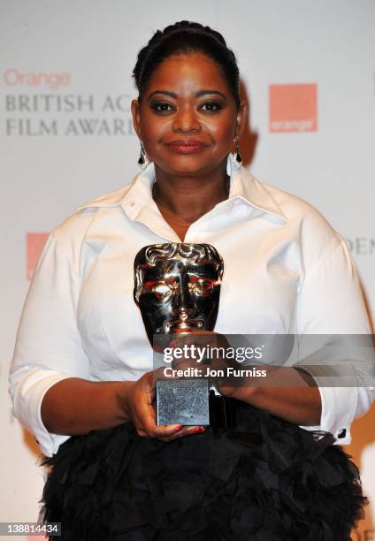 Actress Octavia Spencer poses in the press room with the Best Supporting Actress award during the Orange British Academy Film Awards 2012 at the...