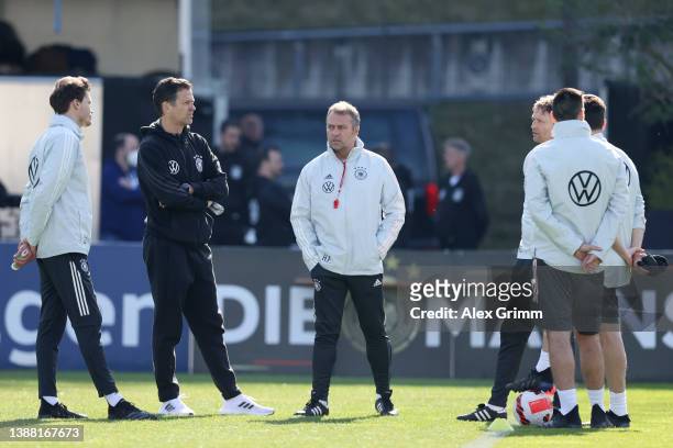Head coach Hans-Dieter Flick, Oliver Bierhoff and coaching staff stand together during a training session of Germany at the Eintracht Frankfurt...