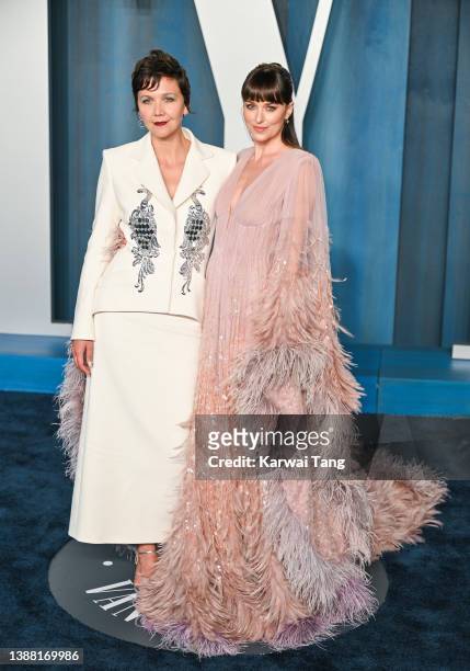 Maggie Gyllenhaal and Dakota Johnson attend the 2022 Vanity Fair Oscar Party Hosted By Radhika Jones at Wallis Annenberg Center for the Performing...