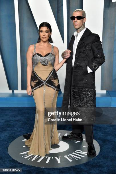 Kourtney Kardashian and Travis Barker attend the 2022 Vanity Fair Oscar Party hosted by Radhika Jones at Wallis Annenberg Center for the Performing...