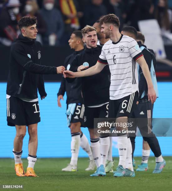 Kai Havertz and Anton Stach of Germany shake hands after the international friendly match between Germany and Israel at PreZero-Arena on March 26,...
